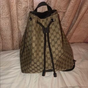Gucci- includes dusk bag
